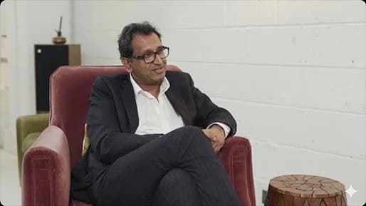 Professor Prasanna Sooriakumaran seated in an armchair, Emerald podcast interview thumbnail