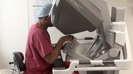 Surgeon seated at a robotic surgical console, prostate cancer overview video thumbnail