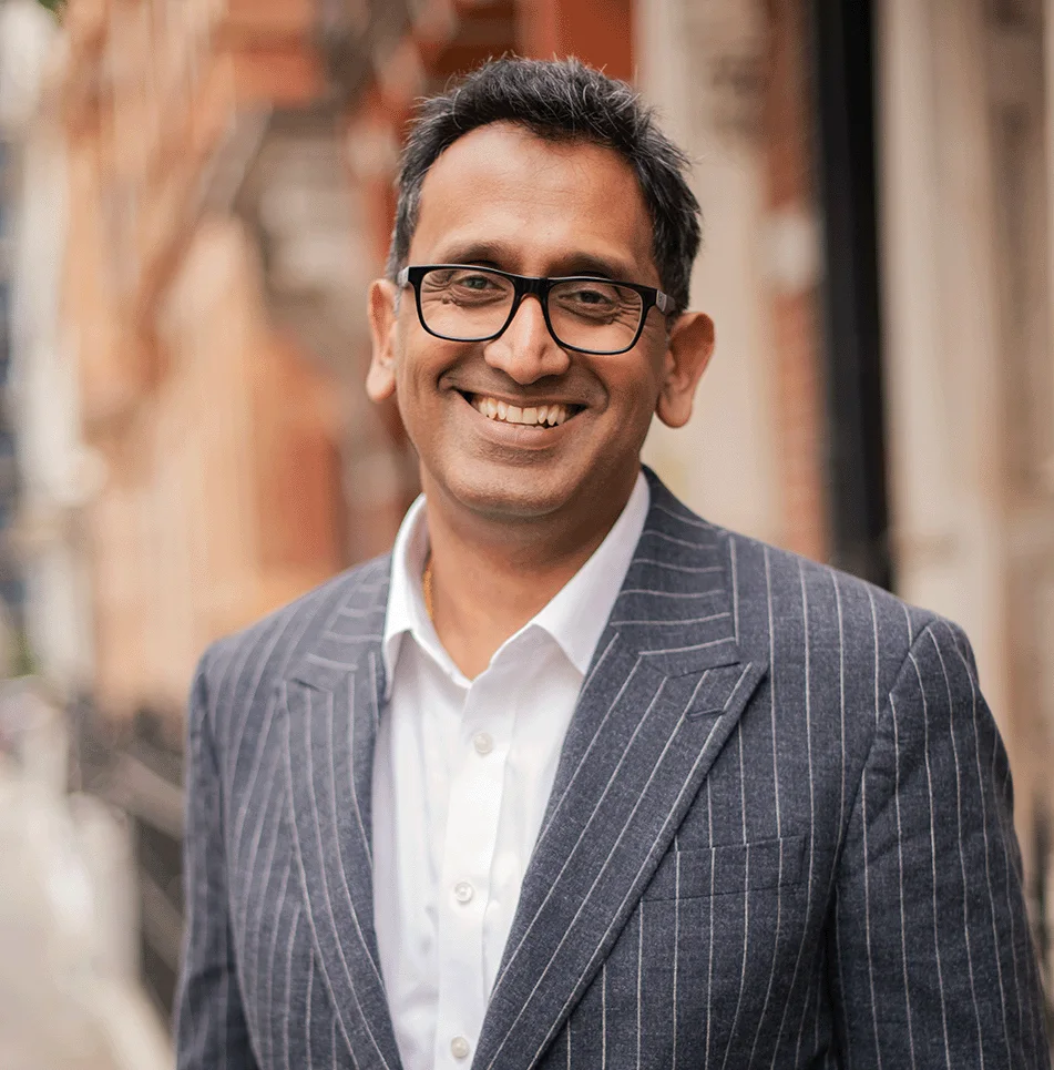 Professor Prasanna Sooriakumaran, smiling portrait
