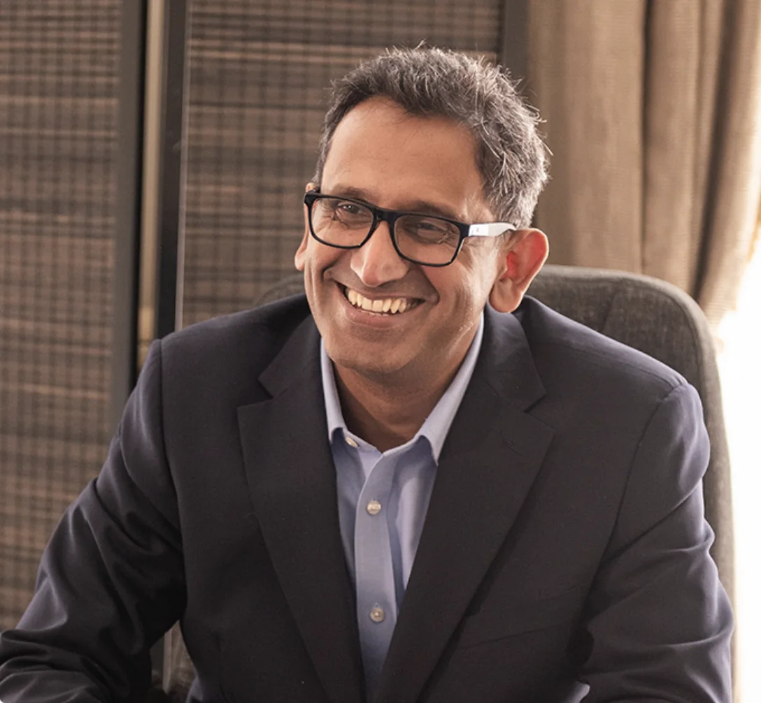Professor Prasanna Sooriakumaran, prostate cancer surgeon, consulting with a patient