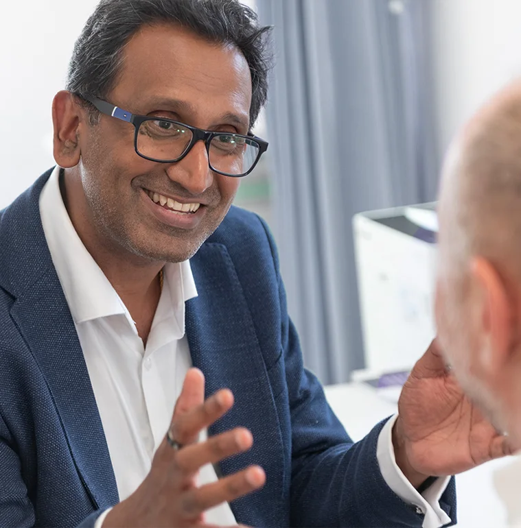 Professor Prasanna Sooriakumaran discussing a patient's care during a consultation