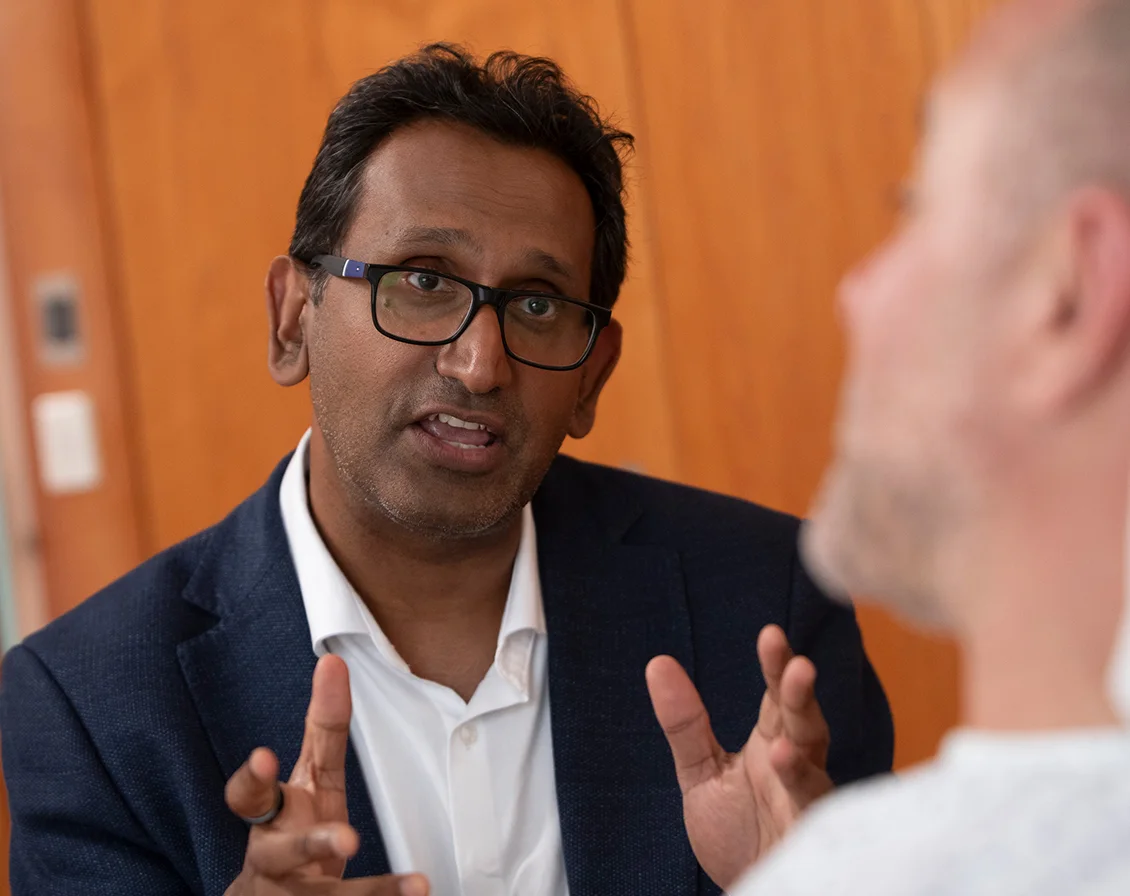 Professor Prasanna Sooriakumaran explaining treatment to a patient