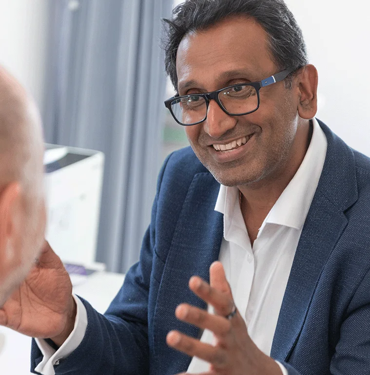 Professor Prasanna Sooriakumaran discussing a patient's care during a consultation