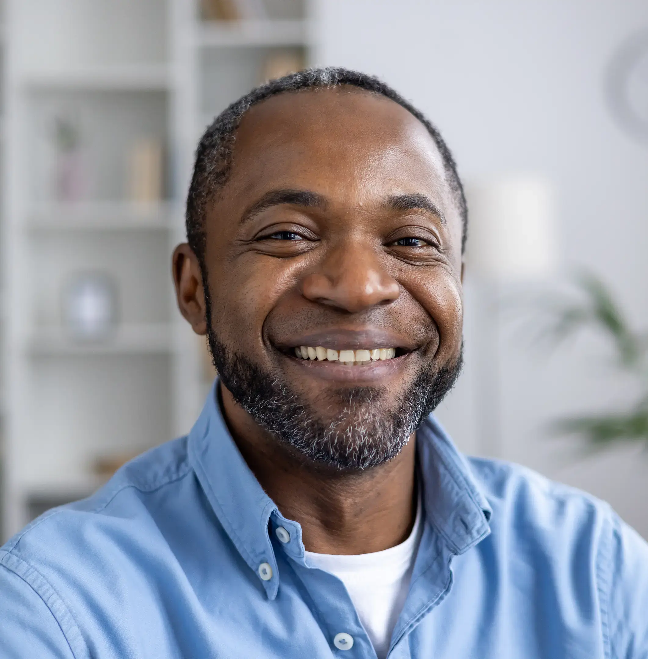Smiling man in a blue shirt