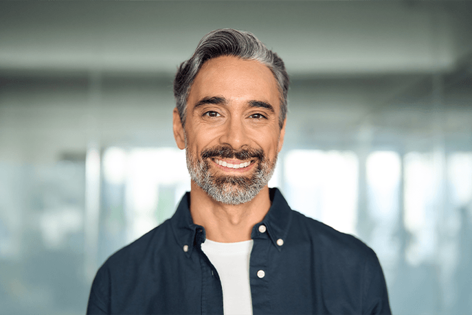 Smiling mature man with a grey beard