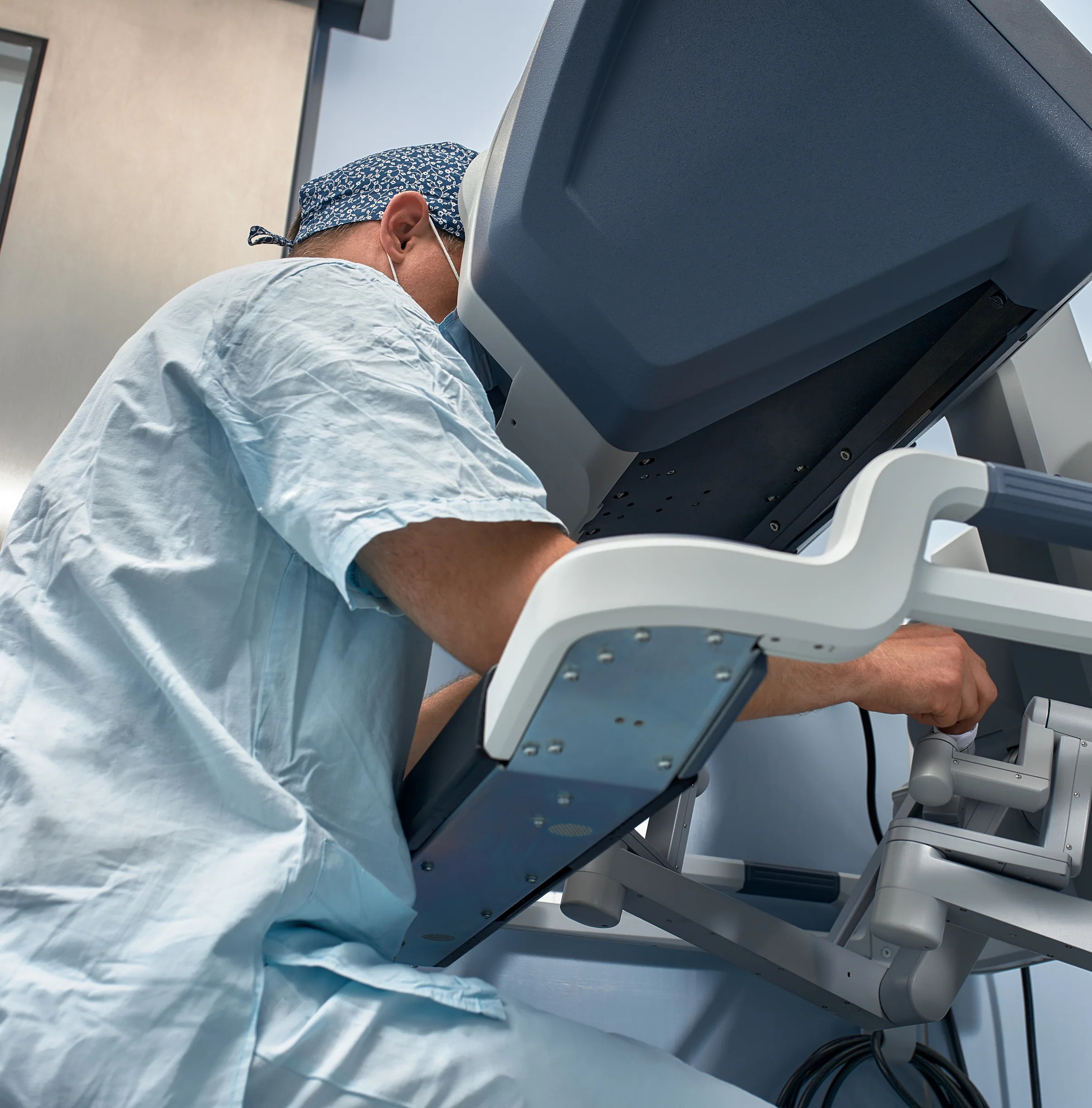 Surgeon using a robotic surgical system in a hospital operating theatre