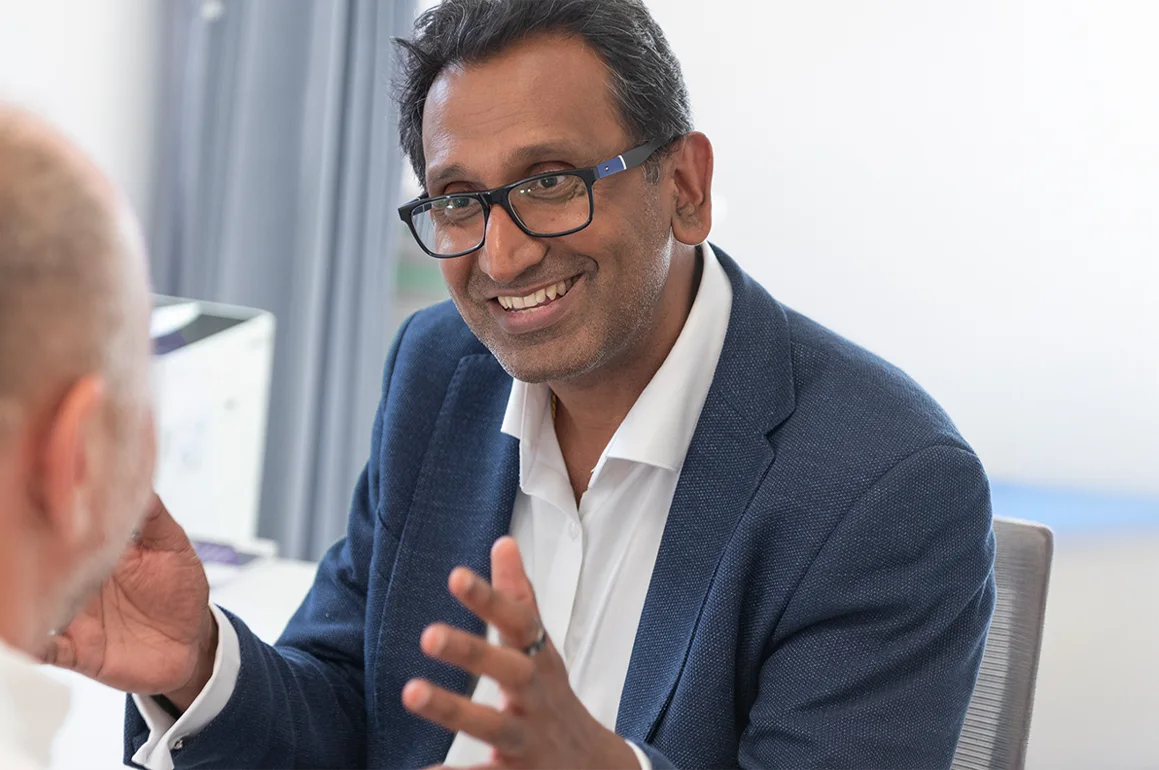 Professor Prasanna Sooriakumaran explaining treatment during a consultation